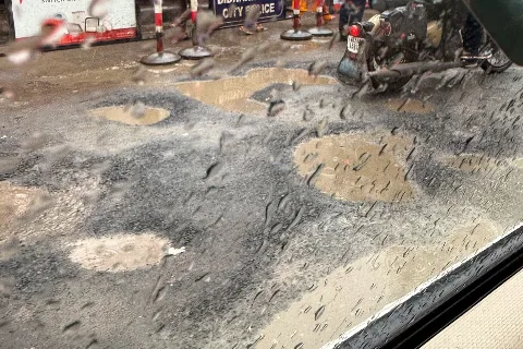 Potholed road (representative)