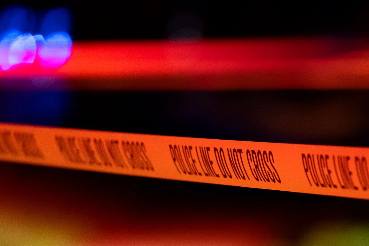 Police tape at a crime scene at night (representative)
