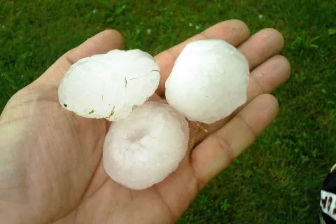 Hailstones in a hand (representative)