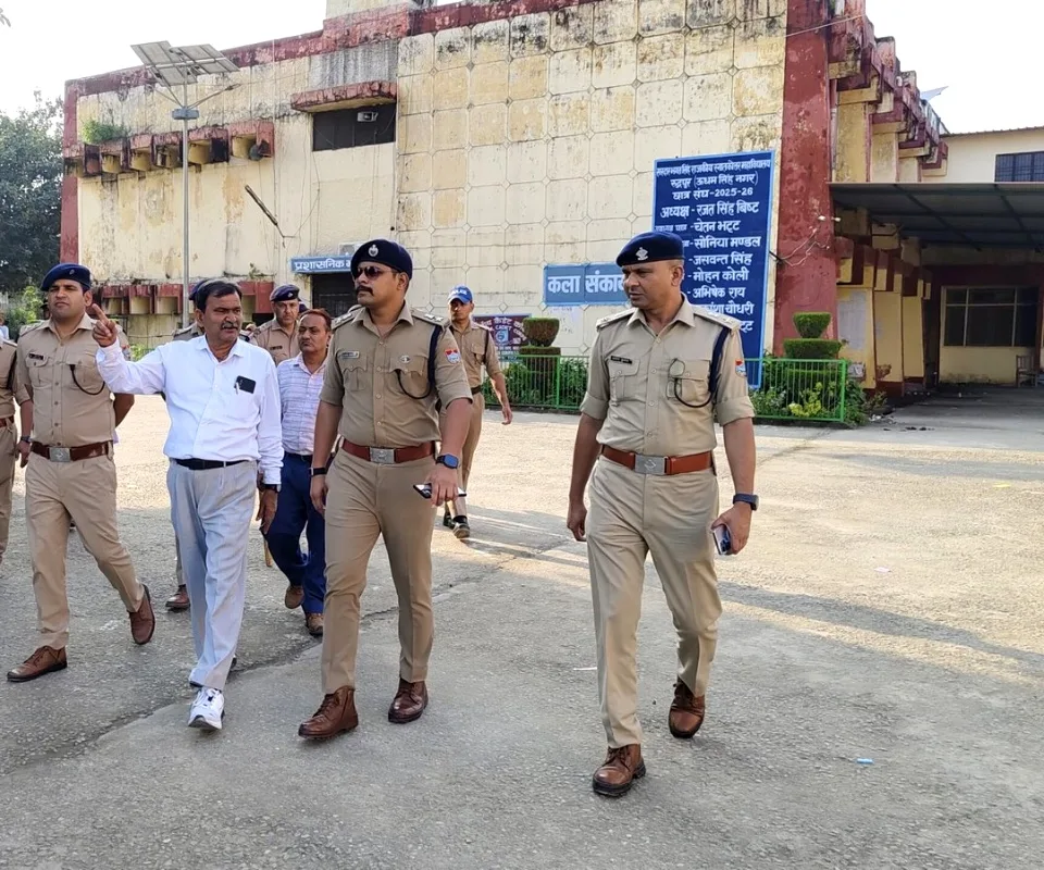 Police officers review security arrangements on the SBS College campus in Rudrapur ahead of the student union election