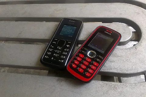 Two keypad mobile phones (representative)