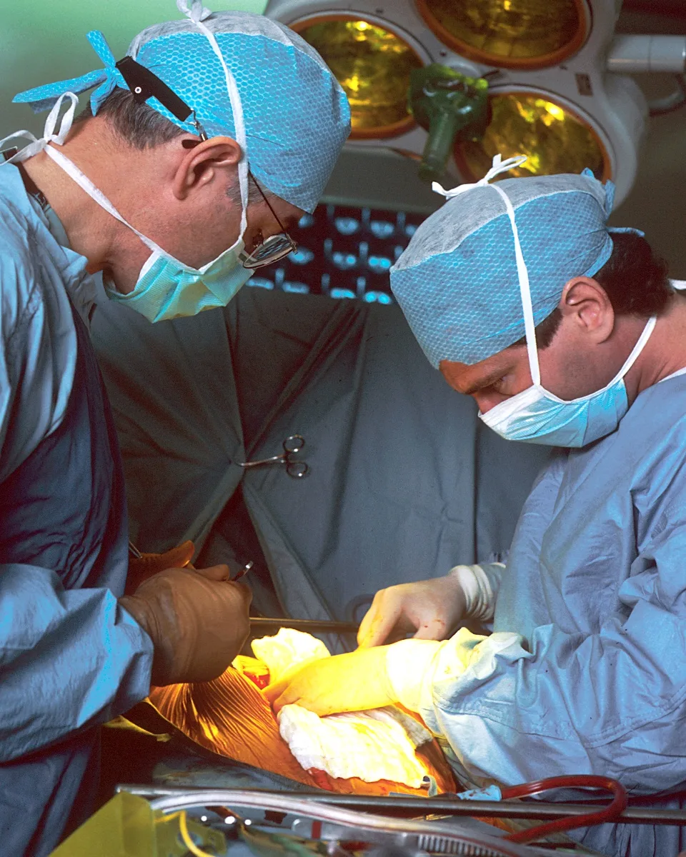 Representative photo: two surgeons operating in an operating theatre