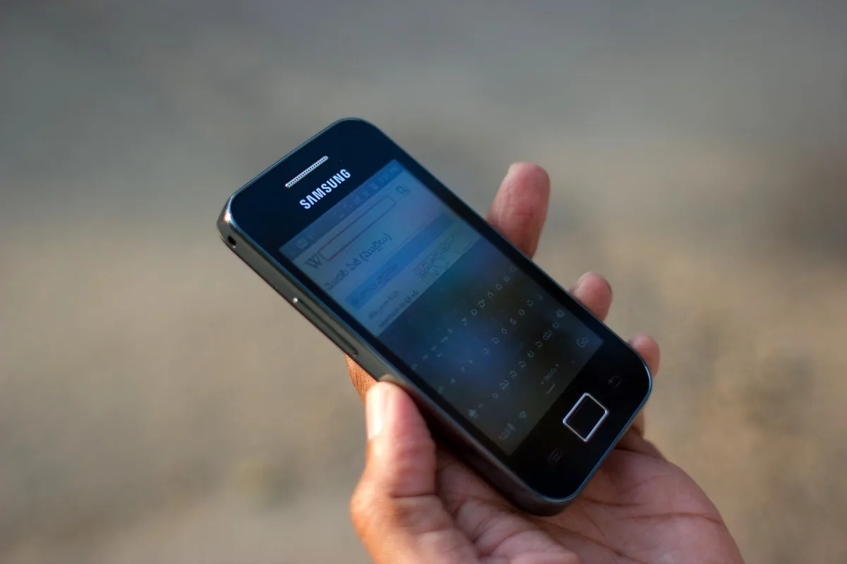 Mobile phone in hand (representative)