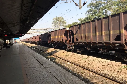 Goods train at a station (representative)